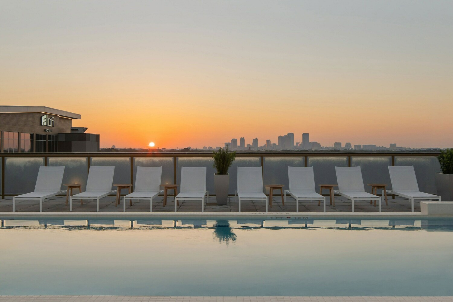 Admire the sunset looking out at beautiful downtown Tampa from a chaise lounge in our rooftop pool